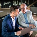 Business People Having Meeting In Modern Office In JHHWL8D 150x150